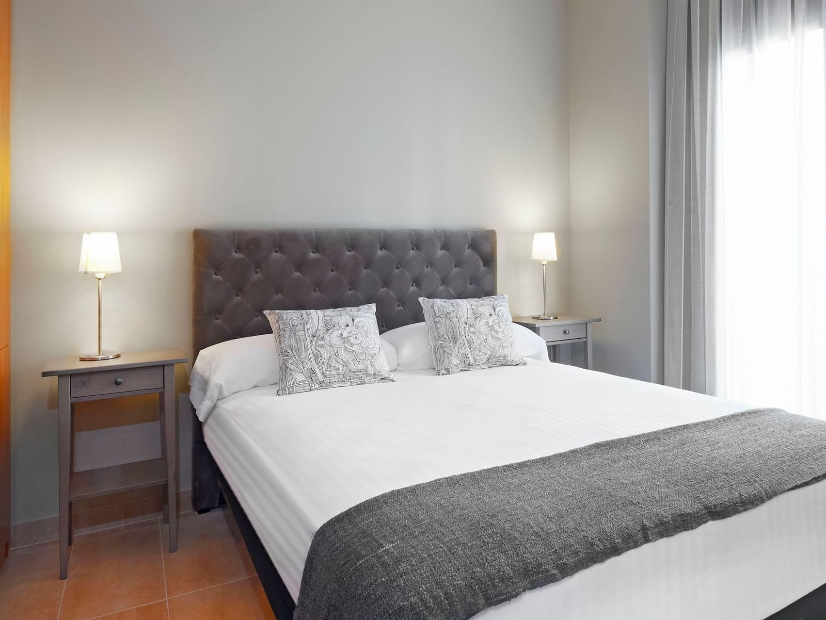 Bedroom arrangement in Deluxe room at Barcelona Apartment