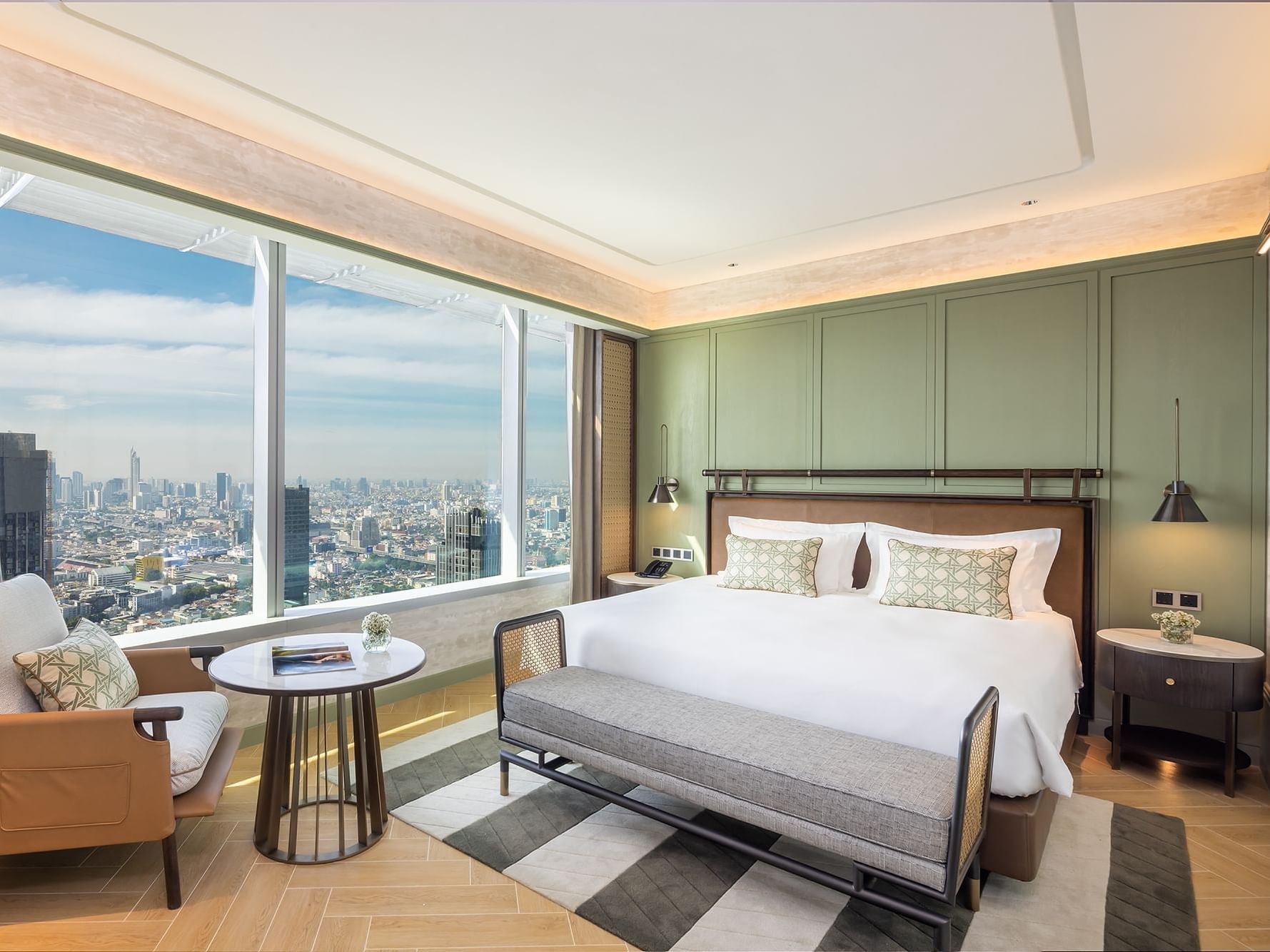 King bed by a window with skyscraper view in 1-bedroom Suite at Eastin Grand Hotel Phayathai