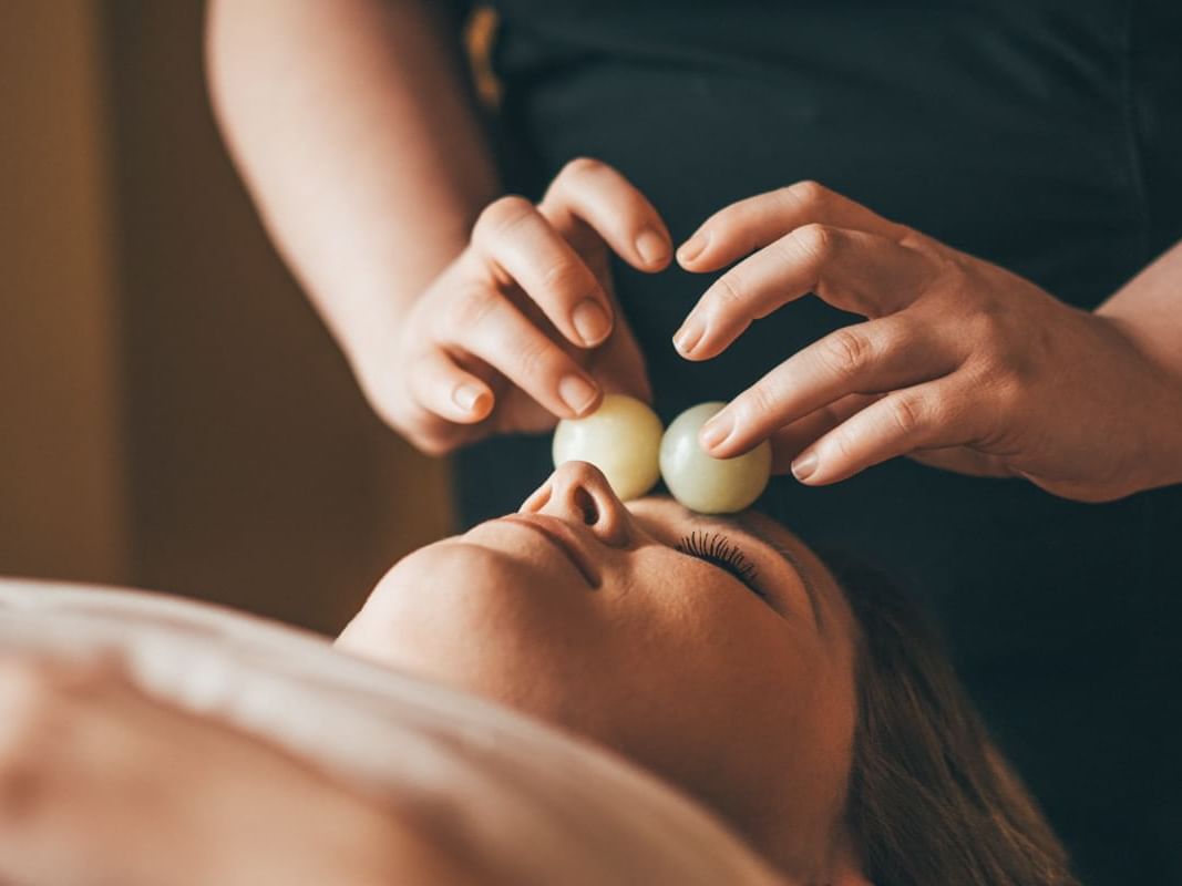 A Lady relaxing with a facial massage in Sun Tree Spa at Temple Gardens Hotel & Spa