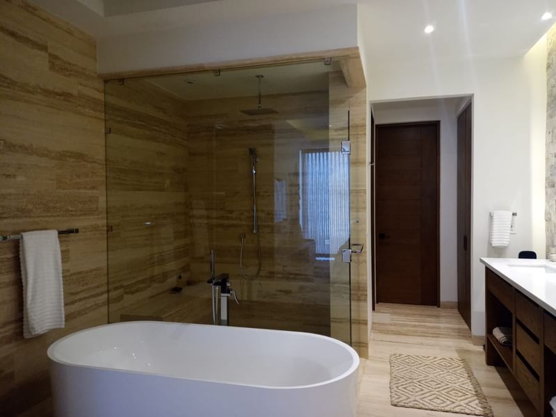 Bathtub, shower area & bathroom vanity in 2 Bedroom Premier at Live Aqua Resorts and Residence Club