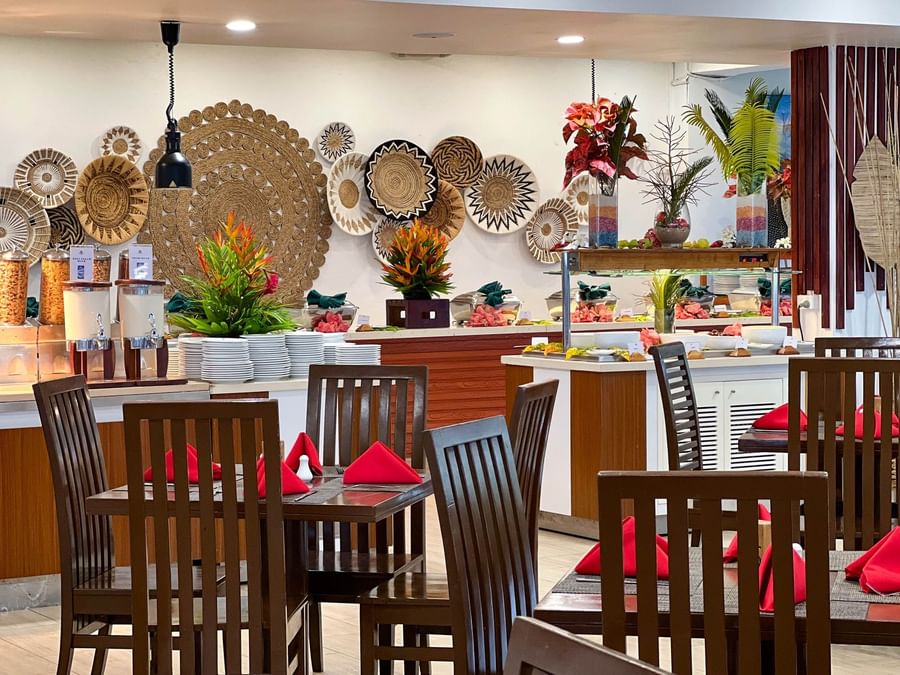 Dining area with tables and chairs at The Naviti Resort Fiji.