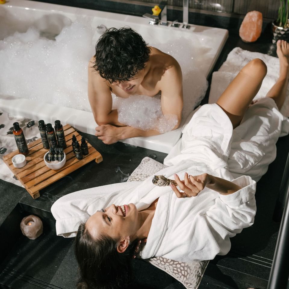 a couple enjoying a spa experience with jacuzzi