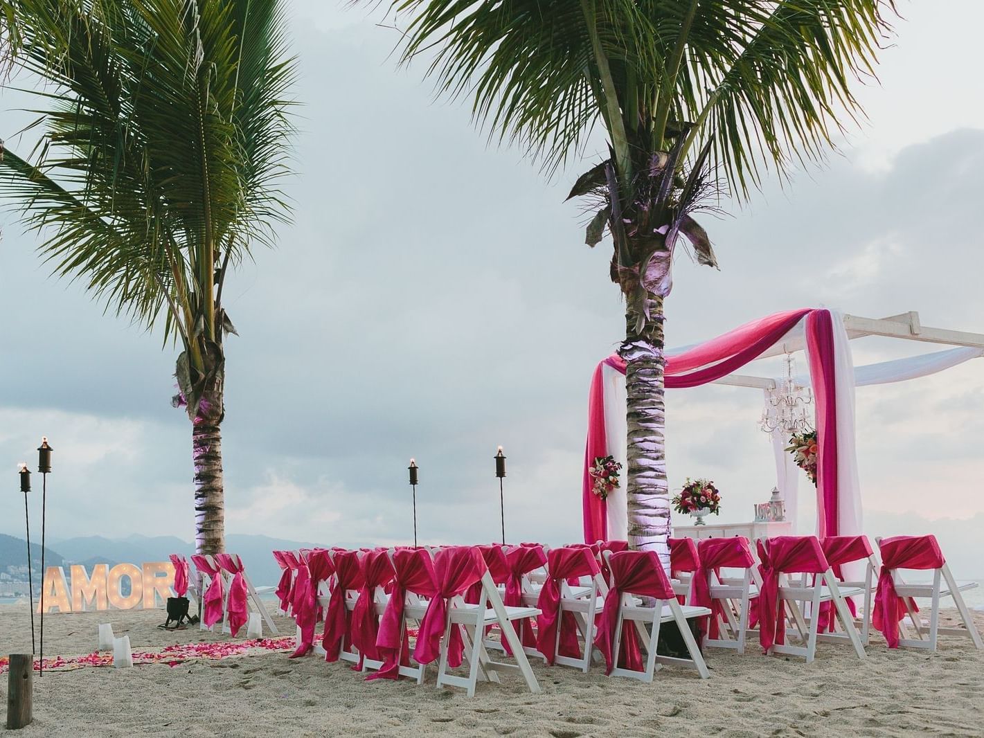 Outdoor beach wedding decorations at La Colección Resorts