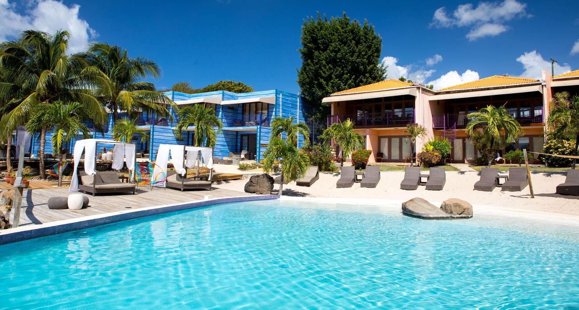 Lounge chairs by the Beach pool at True Blue Bay Hotel