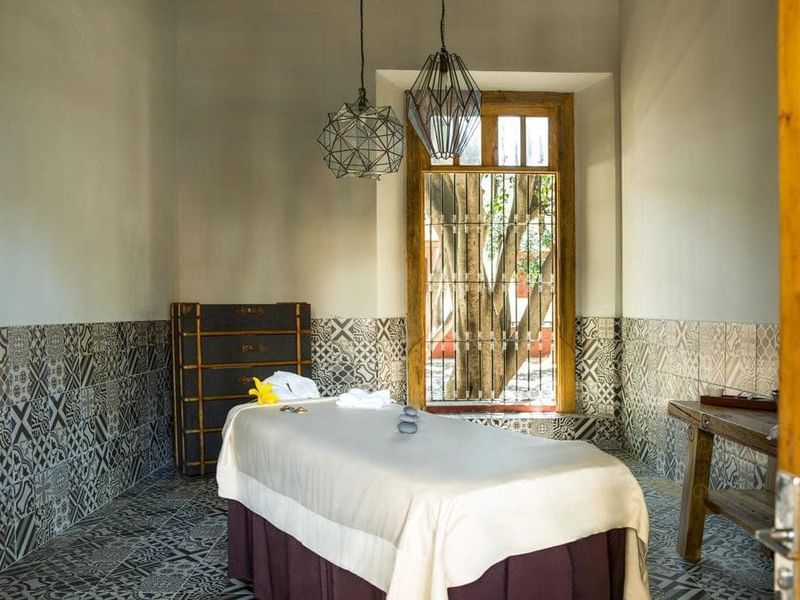 Massage bed with amenities in Misaya spa, La Colección Resorts
