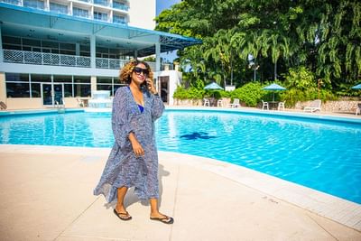 Woman walking by the pool