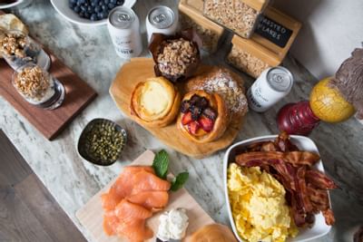 breakfast display with eggs, bacon and fruit