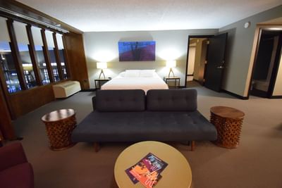 a couch in front of a bed