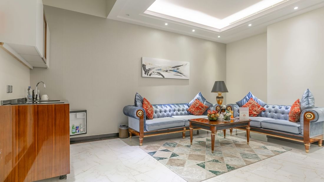 Living area with couches in Junior Suite at Makeen Homes by Warwick - Riyadh