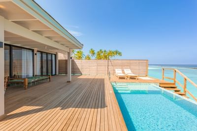 Sunlit terrace in Water Pool Villas at Ananea Madivaru Maldives, with a private pool, sun lounge, and the ocean views