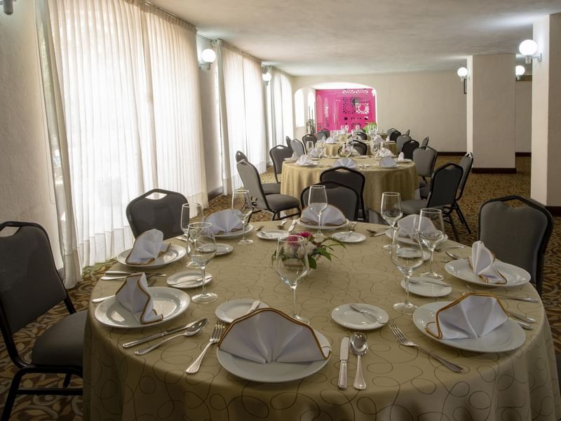 Dining tables arrange for an event in Baranda at Gamma Hotel