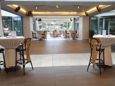 Event pavilion with round tables at  Amora Hotel Melbourne