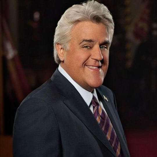 Jay Leno in a suit smiling