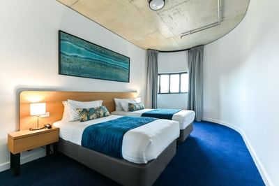 Twin beds in Two Bedroom Suite at Nesuto Curtin Perth Hotel