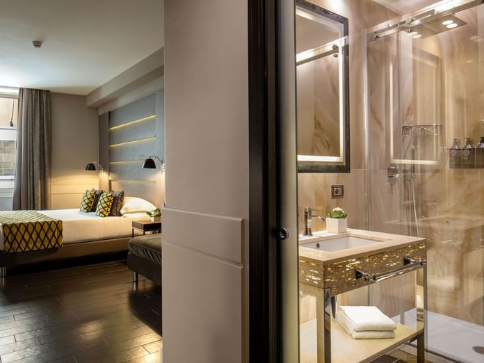 View of the Luxury marbled bathroom with a shower cubical in Deluxe Room at The Style