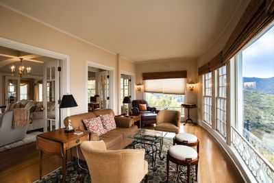 Living room with large windows overlooking mountains in Catalina Island suites at Mt Ada
