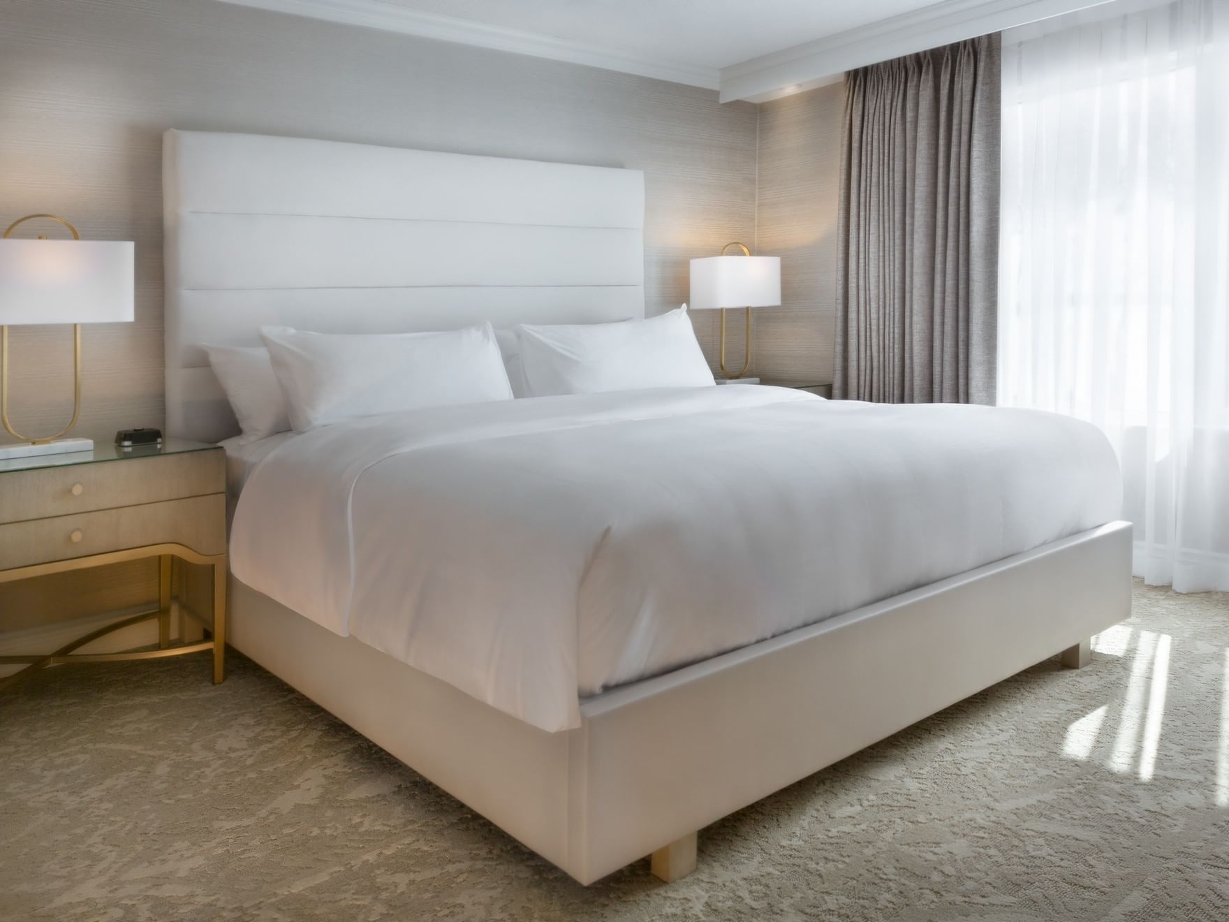 King bed with white sheets in Classic Suite, Chateau Vaudreuil