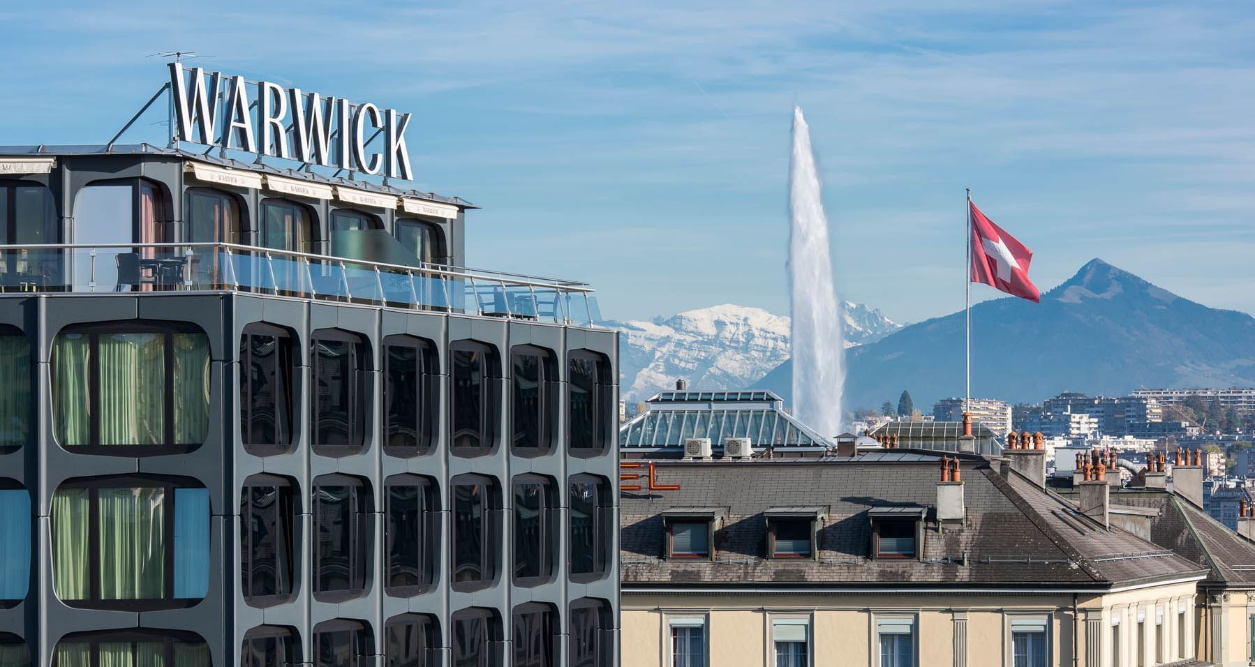 Close-up of the Hotel nameplate of Warwick Geneva