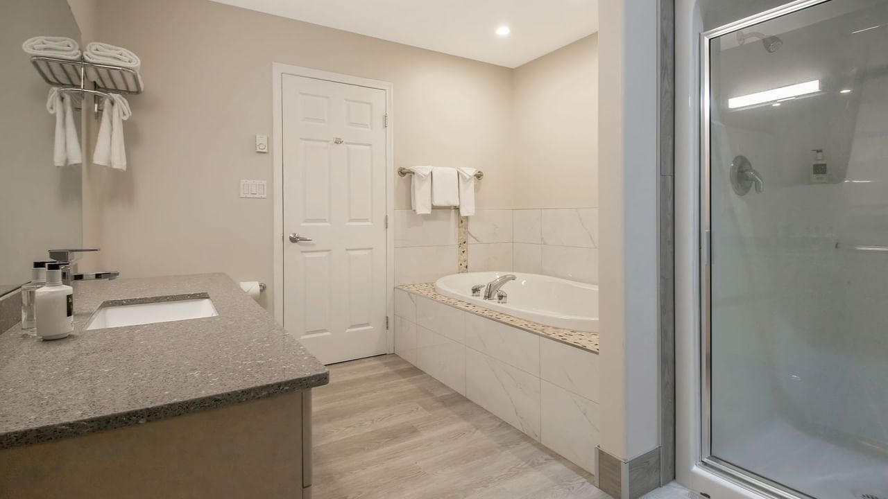 Bath with a tub and shower area