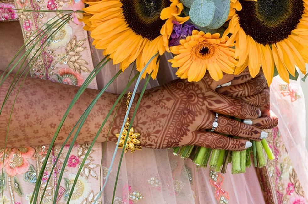mehndi on brides hands and arms at easthampstead park in berkshire