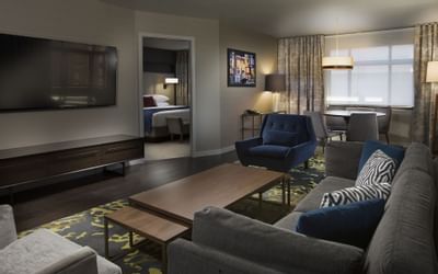 Metropolitan Suite at The Paramount Hotel Seattle with a living room and a bedroom visible in the background