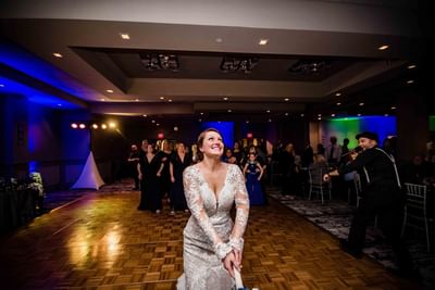 bride about to throw bouquet of flowers