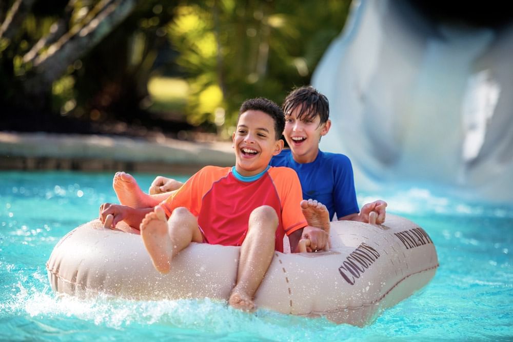 Boys on waterslide at Disney's Typhoon Lagoon near Lake Buena Vista Resort Village & Spa