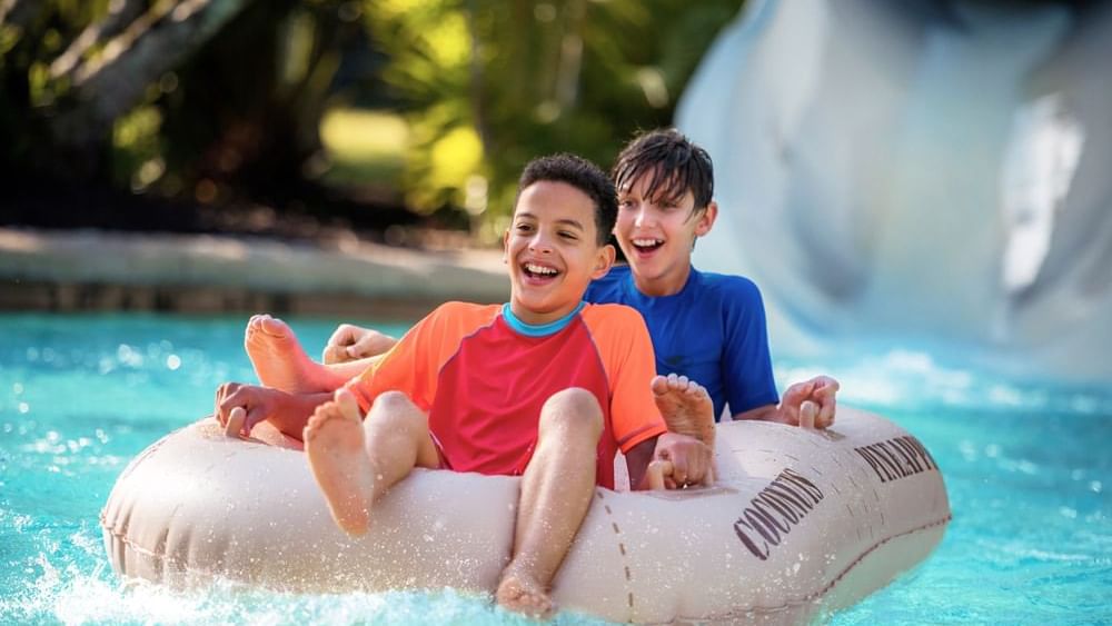 Boys on waterslide at Disney's Typhoon Lagoon near Lake Buena Vista Resort Village & Spa