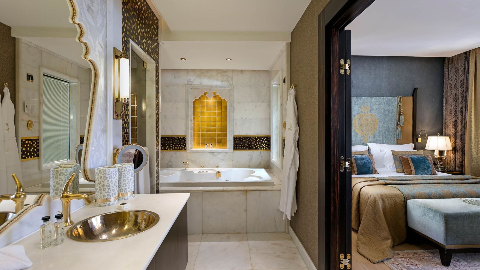 Bathtub and bathroom vanity in Deluxe Room at Titanic Mardan Palace