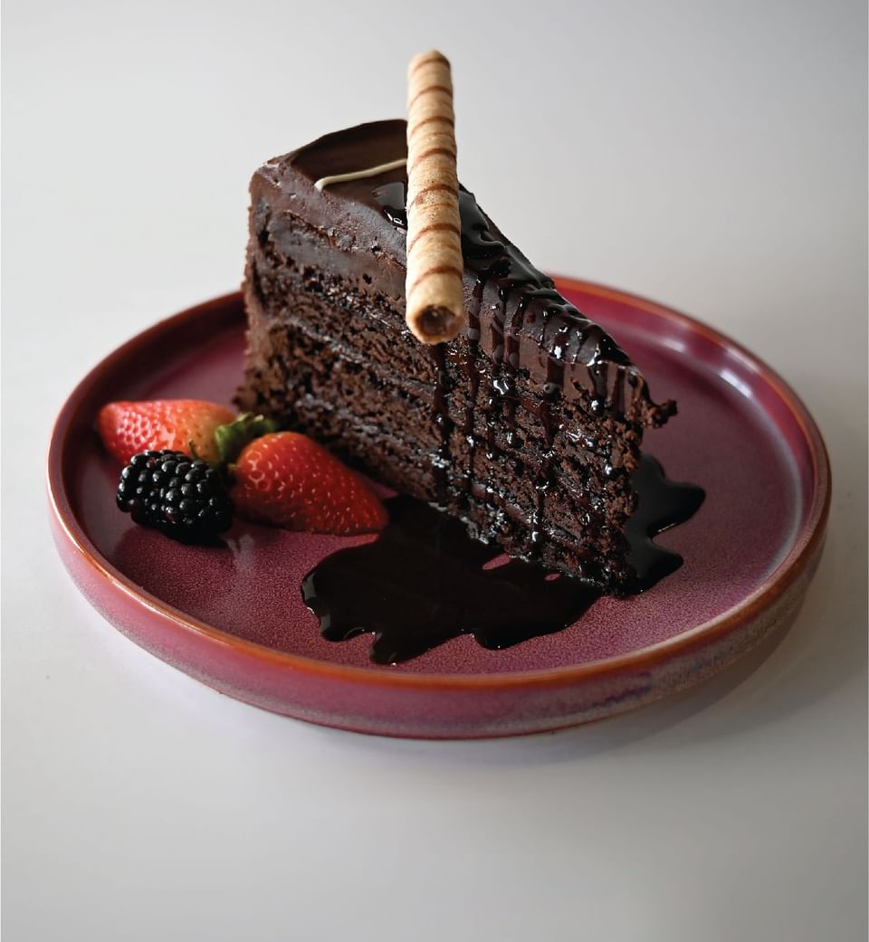 A piece of chocolate cake served at Hotel Clique Calgary Airport