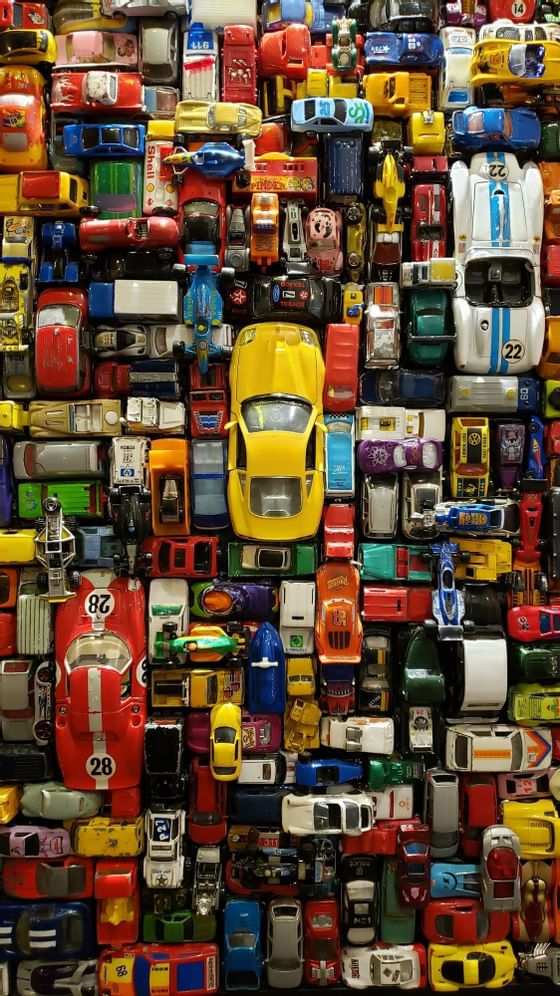 Top view of a collection of toy cars at Retro Suites Hotel