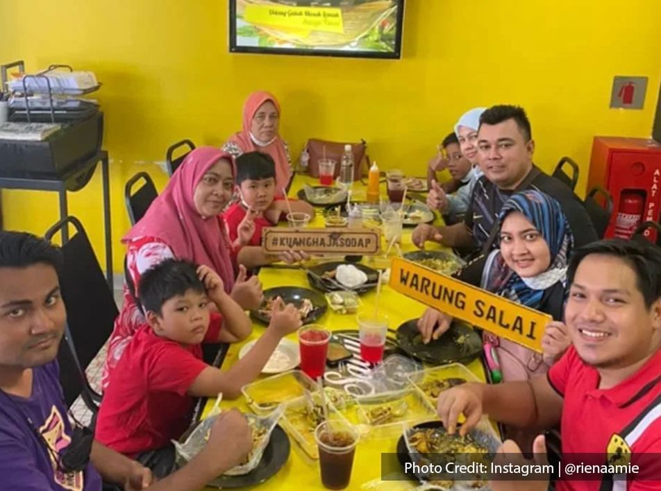 A family enjoying their meal happily at Warung Salai
