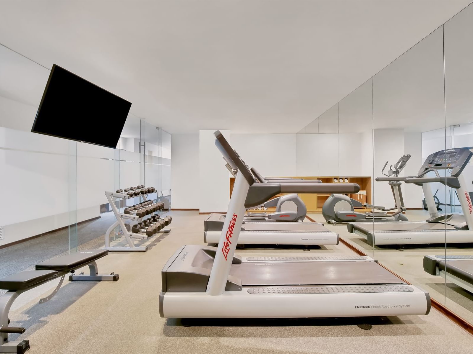 Fitness center with fully equipped machines & weights at Fiesta Inn Puerto Vallarta Isla