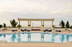 View of sunbeds by the Hotel pool at Polana Serena Hotel