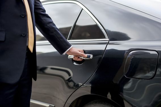 Close-up of a concierge opening the door at Park Hotel Hong Kong