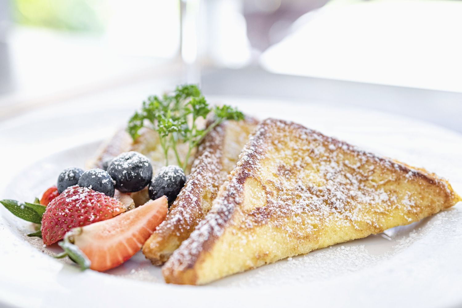 Sweet Bread French Toast served on a dish in Ilima Cafe at Waikiki Resort Hotel