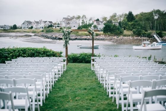 An outdoor wedding ceremony setup at The Breakwater Inn & Spa