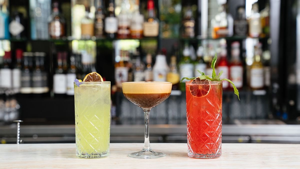 Cocktails on a bar counter with garnishes in Lobby Lounge at Crown Metropol Perth