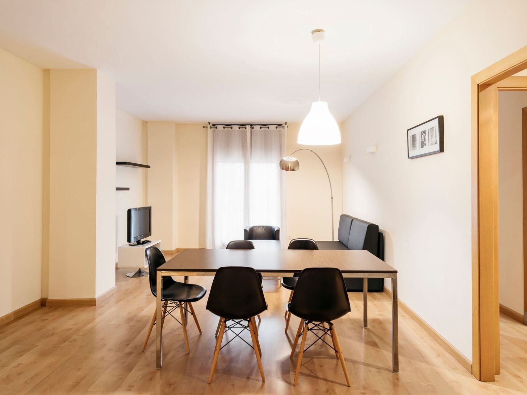 Dining & living area in a room at Barcelona Apartment