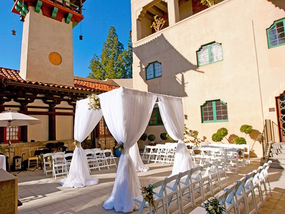 outfoor canopy with rows of chairs surrounding it