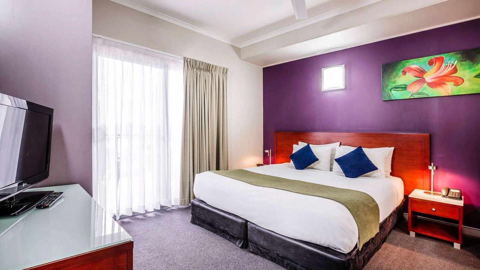 Two Bedroom Suite with a TV at Novotel Darwin Airport