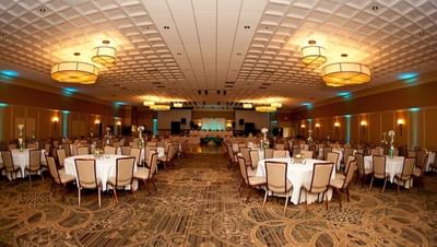 Franklin Building at the Bolger Center set with round tables and chairs for a wedding reception