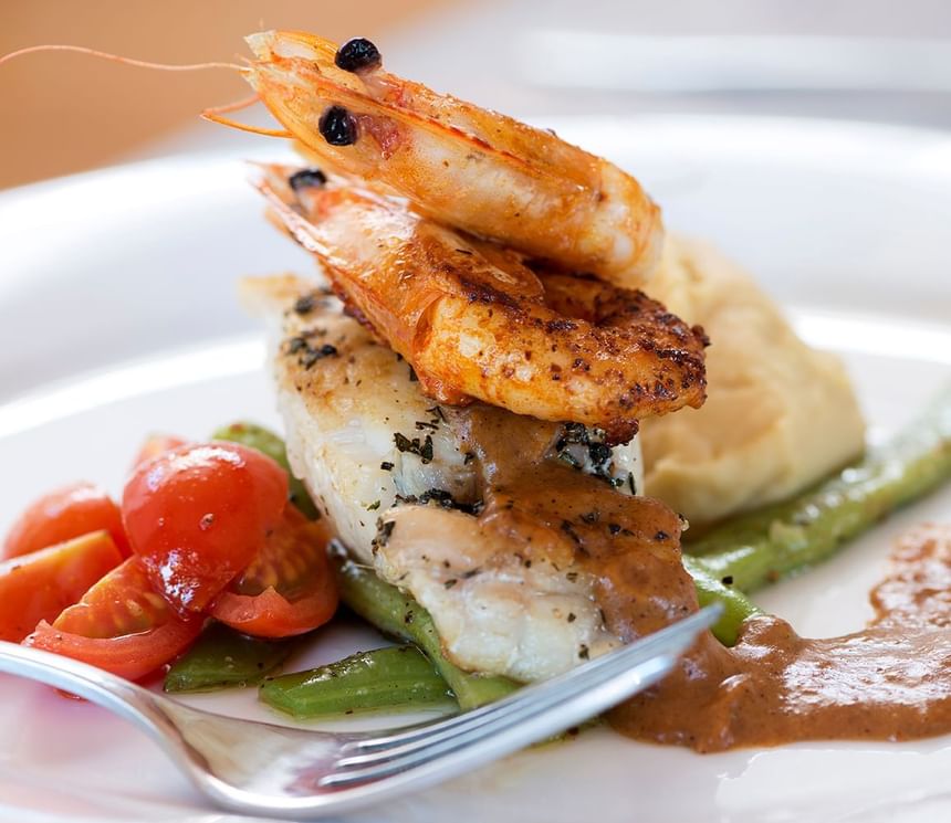 Close-up of Garlic Salmon served in Ensamblaje Restaurant at NOI Blend Colchagua