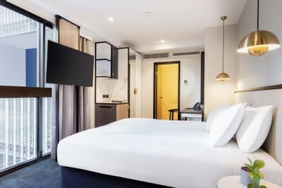 King bed & TV in business room at Brady Hotels Jones Lane