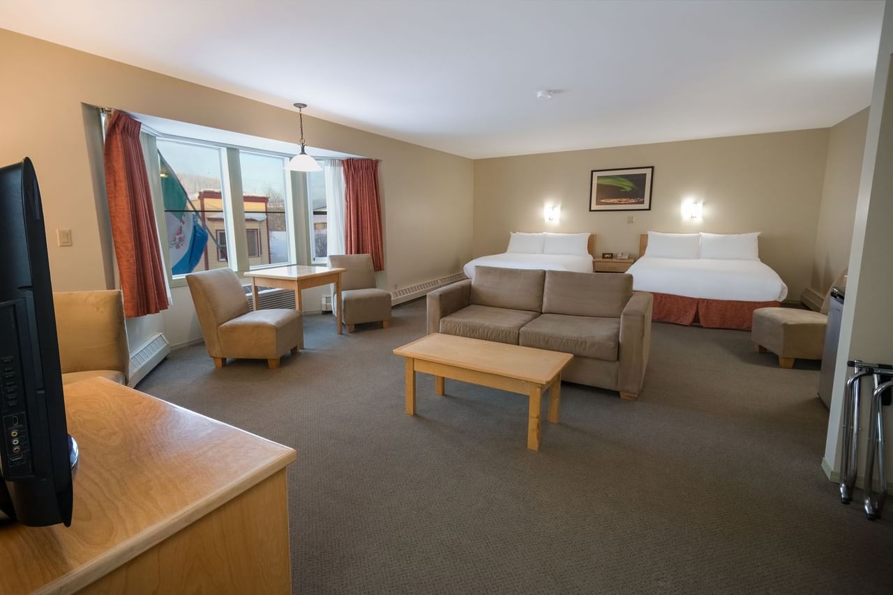 Dawson City, hotel room with seating area and two queen beds