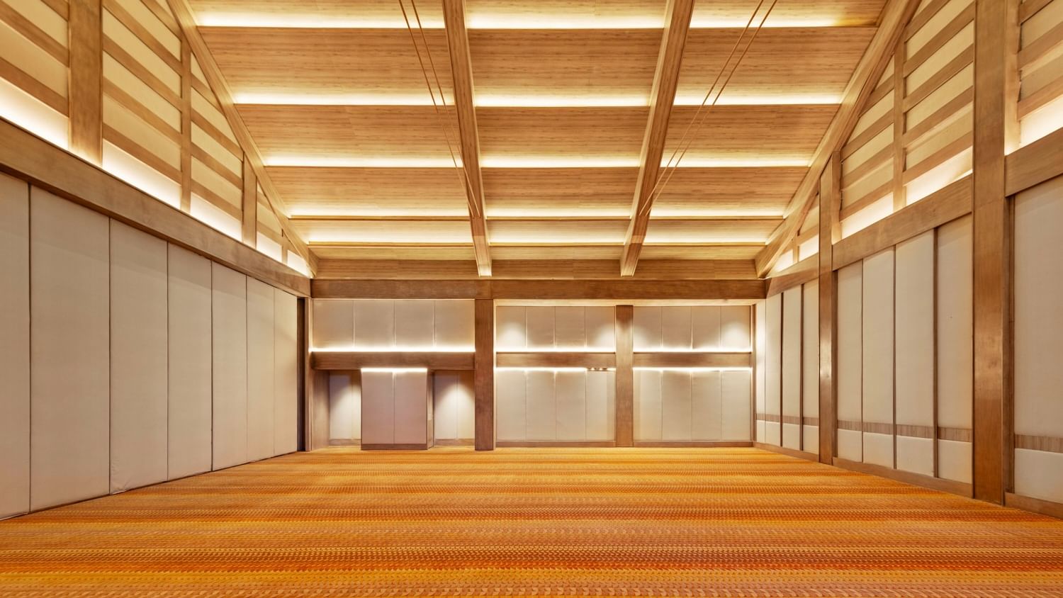 Empty event hall with wooden ceiling and orange floor at Grand Fiesta Americana Sumiya Cuernavaca.