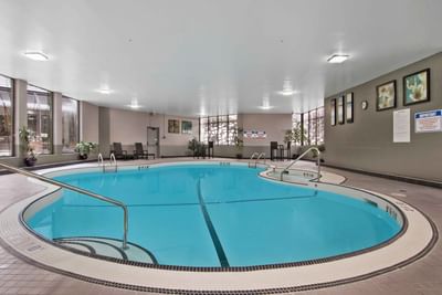 A spacious indoor swimming pool at Best Western Premier