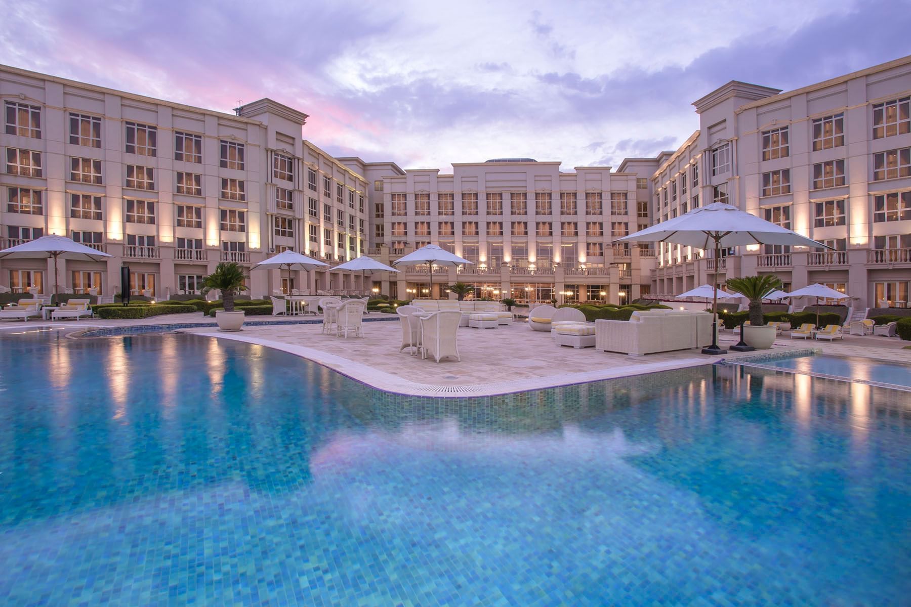 Outdoor family pool with pool loungers at The Regency Hotel