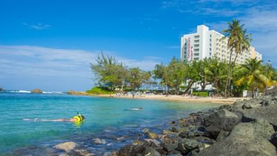 people doing Water sports in the Beach at Condado Plaza Hilton