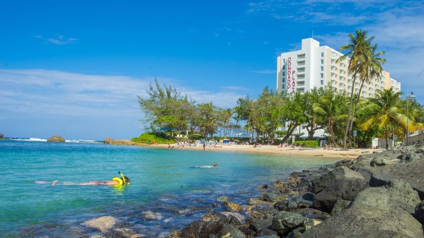 people doing Water sports in the  Beach at Condado Plaza Hilton